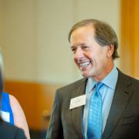 Dan DeVos talking with guests at the Foundation Annual Meeting